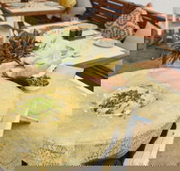 Flaming Cheese Wheel and Wine Experience Broadway - Tourism Gold Coast