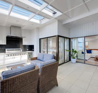 Whispering Sands' 10 Sandy Point Road - Luxury waterfront home with aircon WIFI  Foxtel - Tourism Gold Coast
